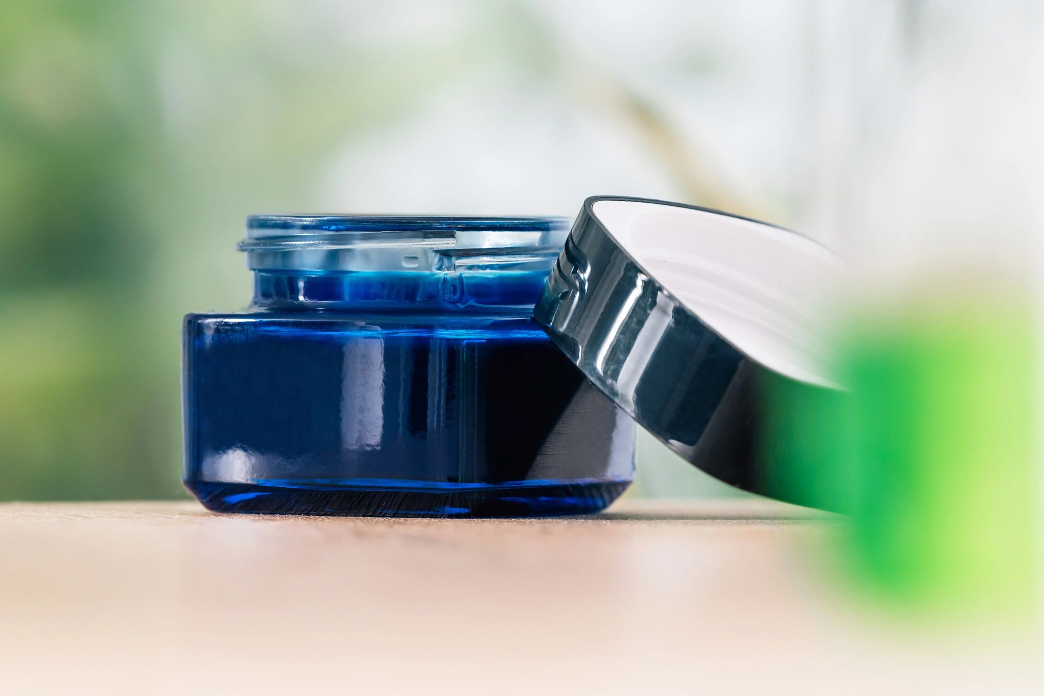 Skincare balm jar on a soft background